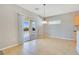 Bright dining area with tile flooring and sliding door access to patio at 2183 Waterton Rivers Dr, Henderson, NV 89044