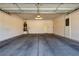 Spacious two-car garage with ample storage space and modern lighting fixtures at 2183 Waterton Rivers Dr, Henderson, NV 89044