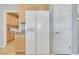 Side-by-side refrigerator in kitchen next to pantry and utility room at 2183 Waterton Rivers Dr, Henderson, NV 89044