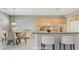 Bright kitchen and breakfast nook feature granite countertops, wood cabinets, and stainless appliances at 2183 Waterton Rivers Dr, Henderson, NV 89044