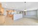 Open kitchen with bar and easy access to living and dining areas at 2183 Waterton Rivers Dr, Henderson, NV 89044