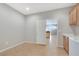 Bright laundry room with washer, dryer and sink adjacent to kitchen at 2183 Waterton Rivers Dr, Henderson, NV 89044