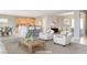 Open concept living and dining areas with modern furniture at 2183 Waterton Rivers Dr, Henderson, NV 89044