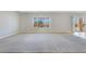 Spacious living room with natural light, large window and sliding doors at 2183 Waterton Rivers Dr, Henderson, NV 89044