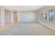 Open living room with window views, neutral paint and easy access at 2183 Waterton Rivers Dr, Henderson, NV 89044