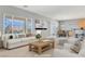 Bright living room with modern furnishings and large windows at 2183 Waterton Rivers Dr, Henderson, NV 89044
