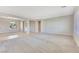 Spacious living room with new carpet, neutral walls, and plenty of natural light at 2183 Waterton Rivers Dr, Henderson, NV 89044