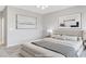 Beautifully staged primary bedroom showcasing a luxurious bed and stylish decor at 2183 Waterton Rivers Dr, Henderson, NV 89044