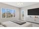 Spacious main bedroom featuring a scenic window view and modern furniture at 2183 Waterton Rivers Dr, Henderson, NV 89044