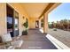 Covered patio offers a relaxing outdoor space with views of the backyard landscaping at 2183 Waterton Rivers Dr, Henderson, NV 89044