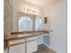 Bathroom featuring a neutral-toned vanity with a large mirror and updated lighting fixture at 2200 S Fort Apache Rd # 2015, Las Vegas, NV 89117