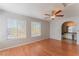 This bright bedroom features wood floors, a ceiling fan, and a bathroom with arched entrance at 2200 S Fort Apache Rd # 2015, Las Vegas, NV 89117