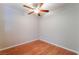 The bedroom features wood-style flooring, a ceiling fan, and bright neutral paint at 2200 S Fort Apache Rd # 2015, Las Vegas, NV 89117