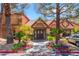 Clubhouse entrance with mature landscaping, rock ground covering, and sidewalk at 2200 S Fort Apache Rd # 2015, Las Vegas, NV 89117