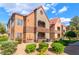 Inviting two-story condo with stucco siding, red tile roof, and well-maintained landscaping at 2200 S Fort Apache Rd # 2015, Las Vegas, NV 89117