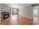 Open living room with a fireplace and sliding glass doors to balcony providing lots of light at 2200 S Fort Apache Rd # 2015, Las Vegas, NV 89117