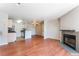 Stylish open concept layout with a cozy fireplace, wood floors, and a breakfast bar at 2200 S Fort Apache Rd # 2015, Las Vegas, NV 89117