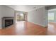 Spacious living room with a fireplace, wood floors, and a sliding door to the balcony at 2200 S Fort Apache Rd # 2015, Las Vegas, NV 89117