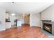 Open concept: Living room with fireplace adjacent to kitchen, perfect for entertaining at 2200 S Fort Apache Rd # 2015, Las Vegas, NV 89117