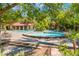 Community pool area with lush greenery and plenty of lounge chairs for relaxing at 2200 S Fort Apache Rd # 2015, Las Vegas, NV 89117