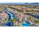 Overhead view showcasing the community pool, covered parking and manicured landscaping in a desirable location at 2325 Windmill Pkwy # 321, Henderson, NV 89074