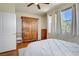 Bedroom with hardwood floors, large wardrobe, and bright windows at 2325 Windmill Pkwy # 321, Henderson, NV 89074
