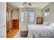 Bright bedroom with hardwood floors, natural light from the windows, and tasteful decor at 2325 Windmill Pkwy # 321, Henderson, NV 89074