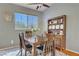 Dining room featuring wood table, upholstered chairs, and display cabinet at 2325 Windmill Pkwy # 321, Henderson, NV 89074