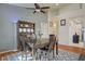 Inviting dining room with hardwood floors, stylish rug, and a classic china cabinet at 2325 Windmill Pkwy # 321, Henderson, NV 89074