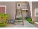 Exterior staircase with metal handrails leading to an upstairs unit at 2325 Windmill Pkwy # 321, Henderson, NV 89074
