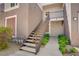 Exterior staircase with metal handrails leading to an upstairs unit at 2325 Windmill Pkwy # 321, Henderson, NV 89074