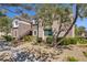 Inviting condo with well-maintained landscaping and cozy exterior staircase at 2325 Windmill Pkwy # 321, Henderson, NV 89074