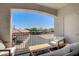 Enjoy outdoor relaxation on this patio with a wrought iron railing and comfortable seating at 2325 Windmill Pkwy # 321, Henderson, NV 89074