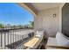 Enjoy outdoor relaxation on this patio with a wrought iron railing and comfortable seating at 2325 Windmill Pkwy # 321, Henderson, NV 89074