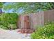 Charming backyard featuring a decorative fountain, lush greenery, and well-maintained landscaping at 2410 Sunburst View St, Henderson, NV 89052