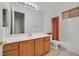 Bright bathroom featuring a large vanity with ample storage and a shower-tub combo at 2410 Sunburst View St, Henderson, NV 89052