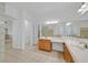 Light and bright bathroom featuring double sinks, soaking tub, and glass block detail at 2410 Sunburst View St, Henderson, NV 89052