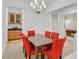 Formal dining room featuring a modern chandelier and access to a billiard room at 2410 Sunburst View St, Henderson, NV 89052