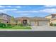 Attractive single-story home boasts a three-car garage and well-maintained landscaping at 2410 Sunburst View St, Henderson, NV 89052