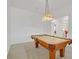 Comfortable game room featuring a classic pool table with decorative overhead lighting at 2410 Sunburst View St, Henderson, NV 89052