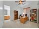 Home office featuring a large desk, built-in bookshelves, and bright natural light at 2410 Sunburst View St, Henderson, NV 89052