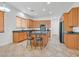 Modern kitchen featuring a large island, updated appliances, and ample cabinet space at 2410 Sunburst View St, Henderson, NV 89052