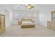 Spacious main bedroom featuring a ceiling fan and three windows at 2410 Sunburst View St, Henderson, NV 89052