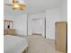 Bright main bedroom boasts ceiling fan, neutral carpet, and closet access at 2410 Sunburst View St, Henderson, NV 89052