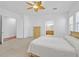 Large main bedroom featuring ceiling fan, neutral carpet and bright natural light at 2410 Sunburst View St, Henderson, NV 89052