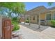 Outdoor patio area includes a pergola, grill, and fountain at 2410 Sunburst View St, Henderson, NV 89052