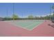 Community tennis courts surrounded by mature landscaping and benches at 2410 Sunburst View St, Henderson, NV 89052