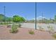 Community sand volleyball court surrounded by mature landscaping and convenient walking paths at 2410 Sunburst View St, Henderson, NV 89052