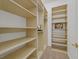 Spacious walk-in closet with open shelving providing ample storage and organization options at 2410 Sunburst View St, Henderson, NV 89052