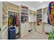 Large walk-in closet featuring custom shelving and storage solutions at 2410 Sunburst View St, Henderson, NV 89052